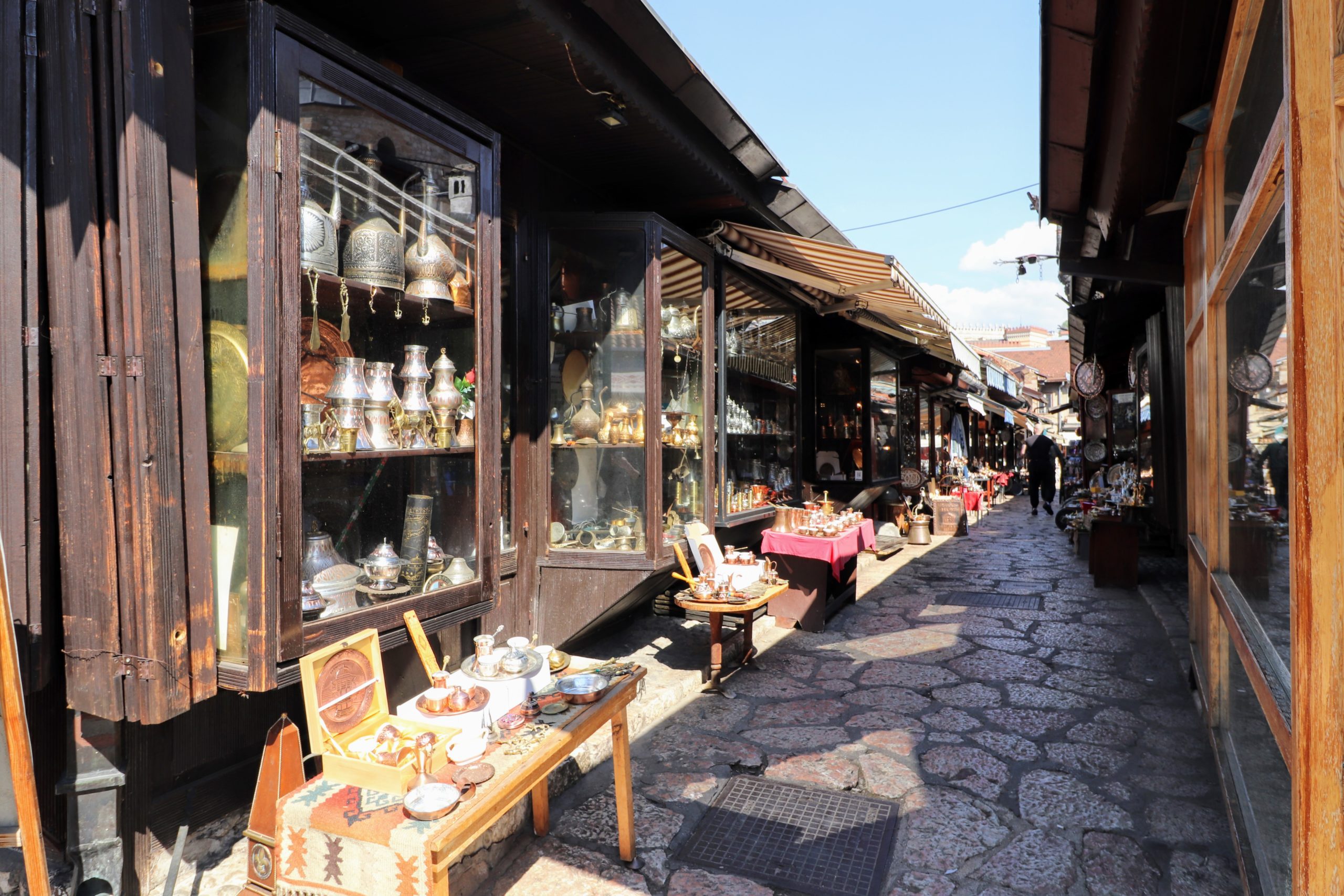 alley lined with shops selling copper handicrafts