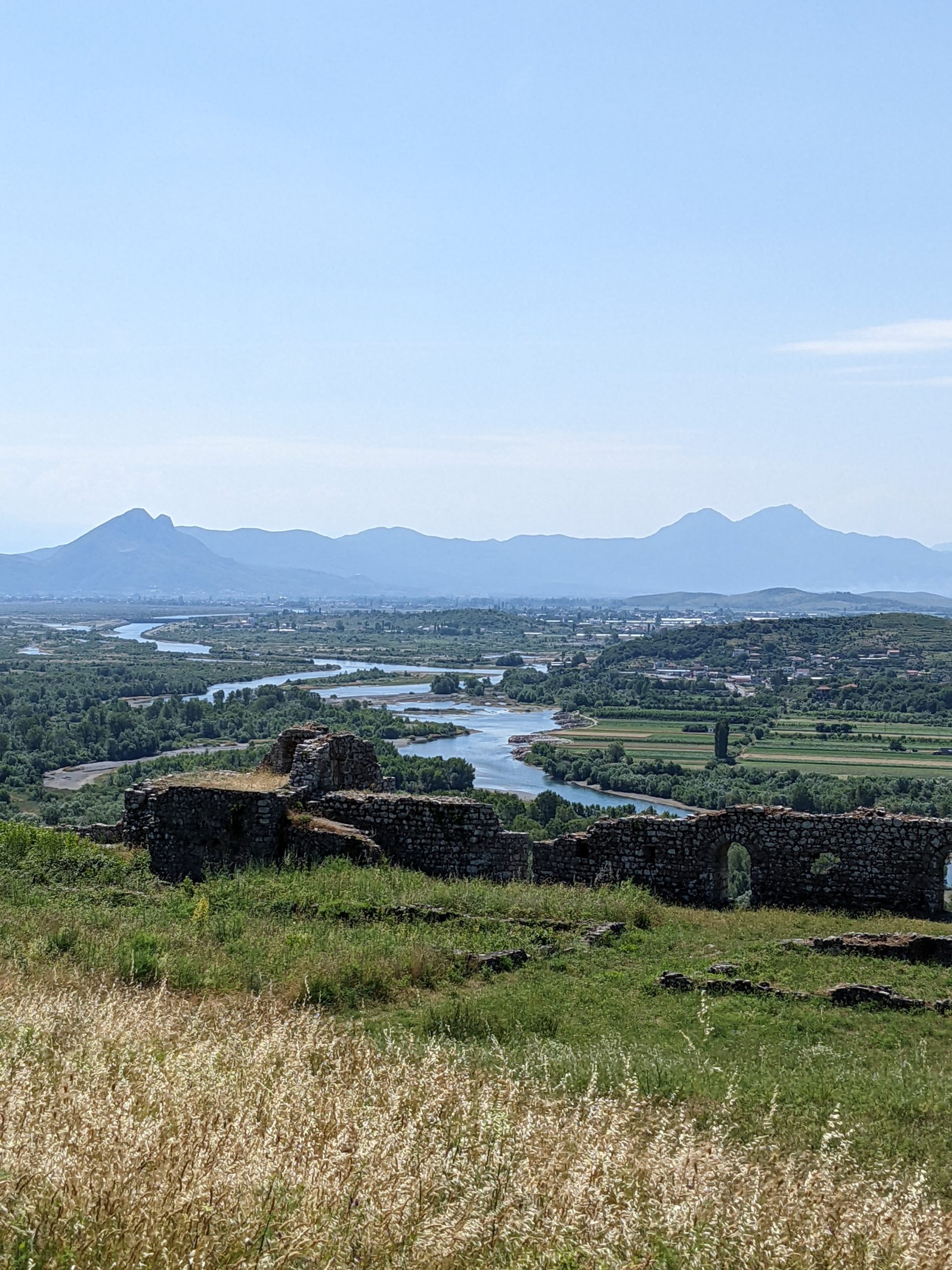 views over a meandering river and a mountain backdrop