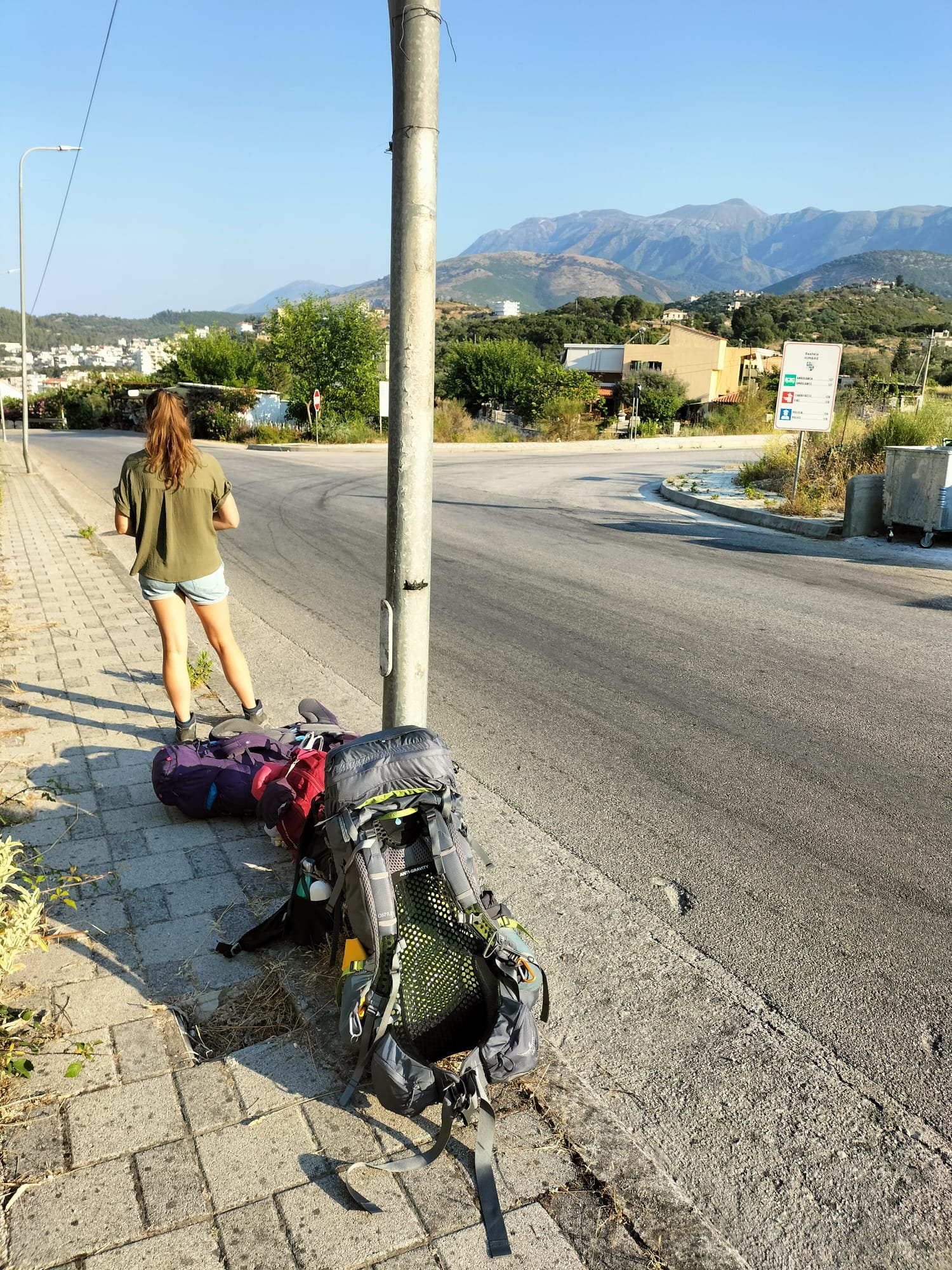 waiting for a furgon at the roadside, albania bus travel