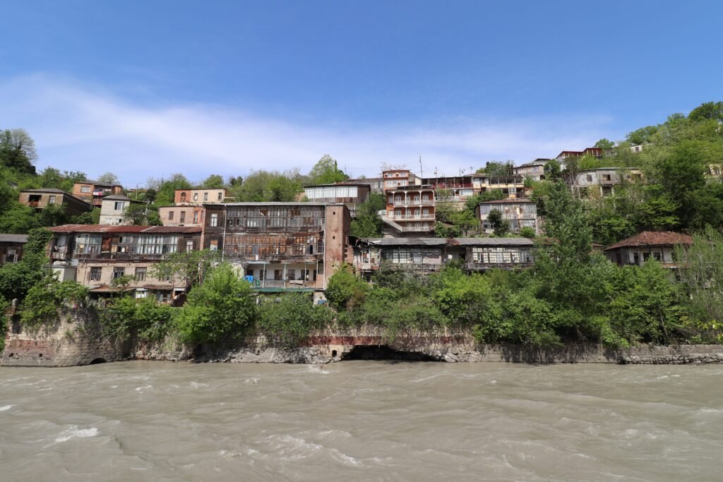 Kutaisi Rioni River viewpoint a view from one side of Rioni River in Kutaisi looking up the other bank at traditional buildings with balconies