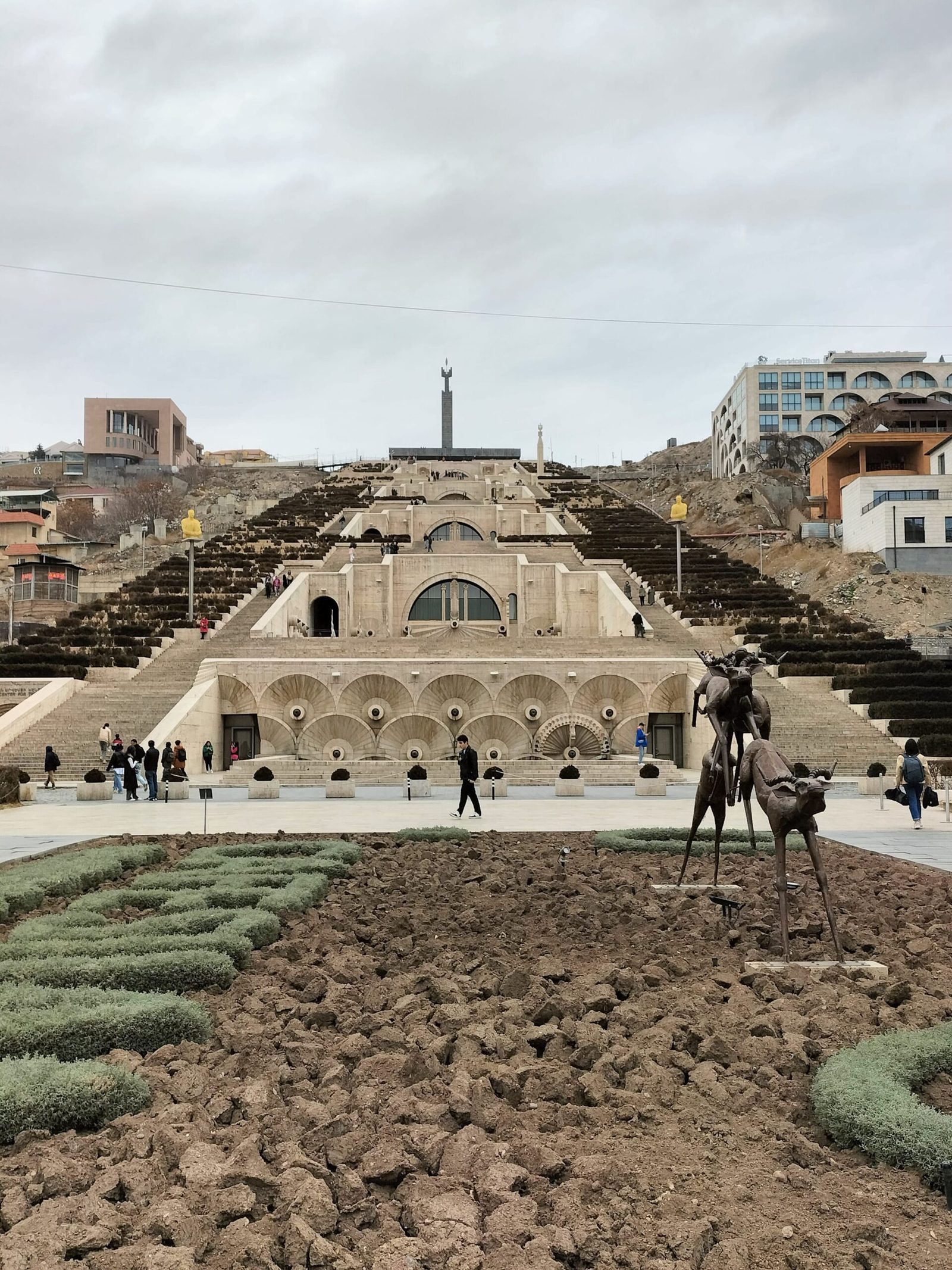 Stone steps with art displays leads to a viewpoint at the top of the Cascade in Yerevan Armenia to view Mount Ararat and the city