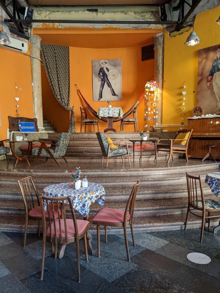 quirky cafe interior with bright orange walls