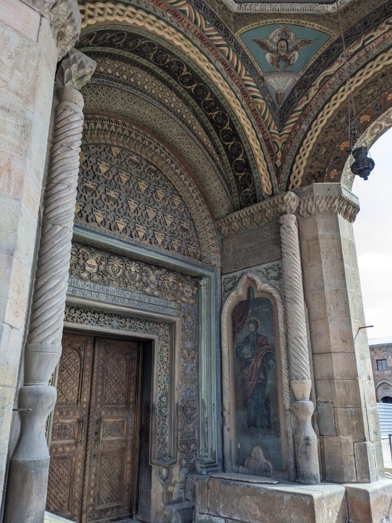 etchmiadzin cathedral decoration above entrance way vagharshapat, day trip from yerevan