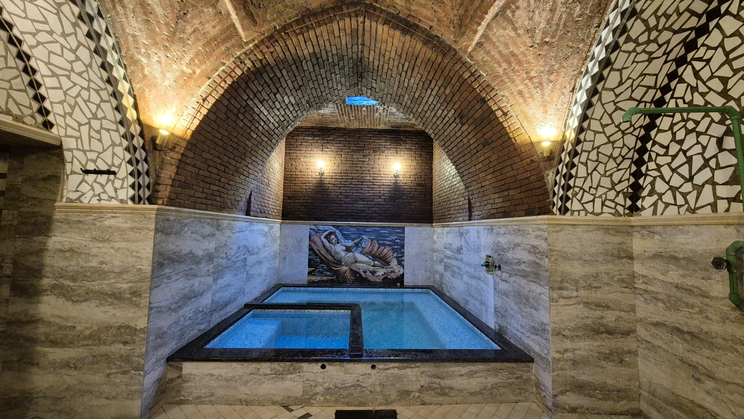 sulphur bath tbilisi christmas the interior of a traditional thermal sulphur bath in Tbilisi Georgia. There is a brick domed ceiling, a mosaic of a woman on the wall, and a square pool split into a hot pool and a cold pool