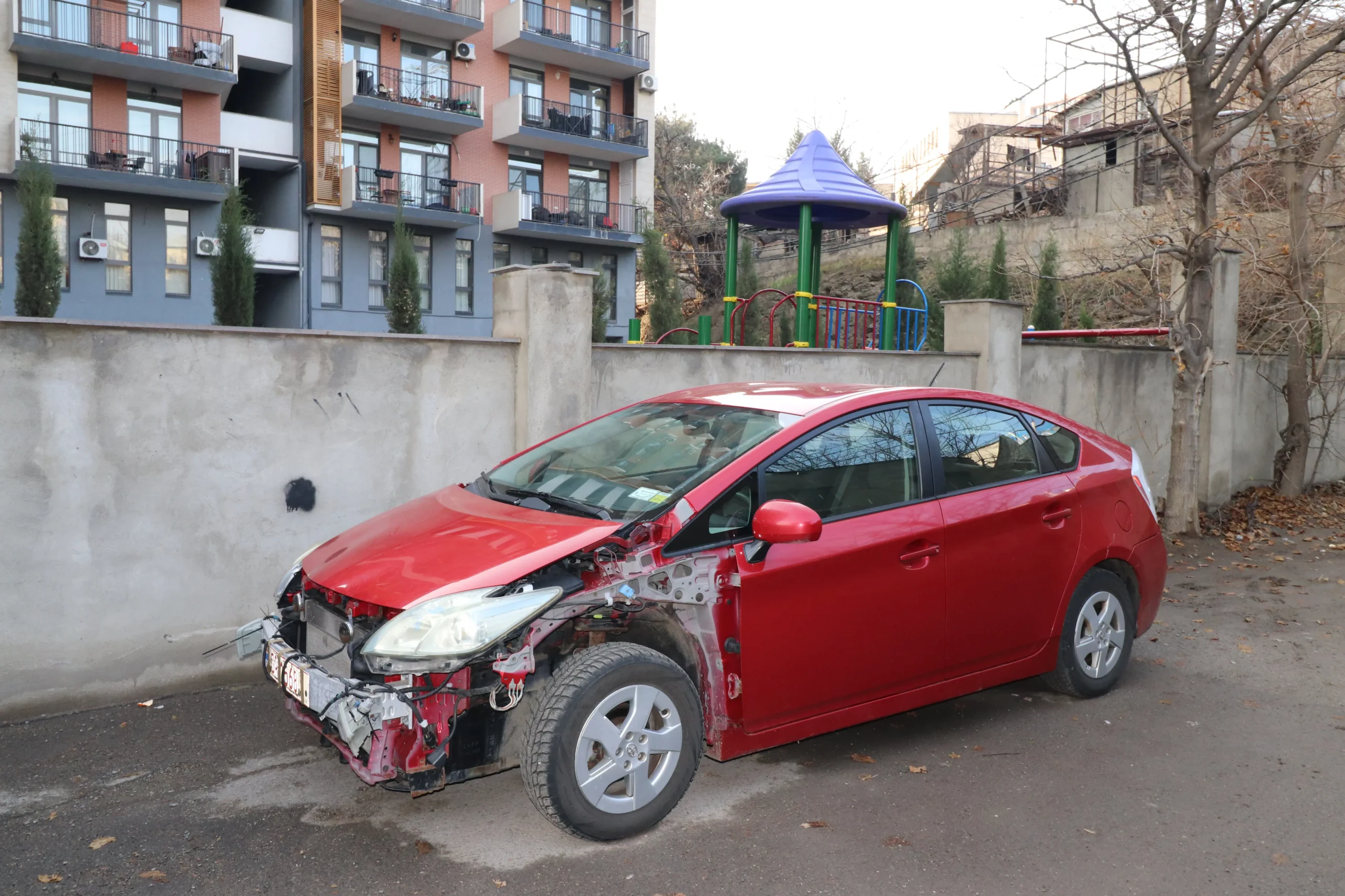 a wrecked car has the left and front panels missing