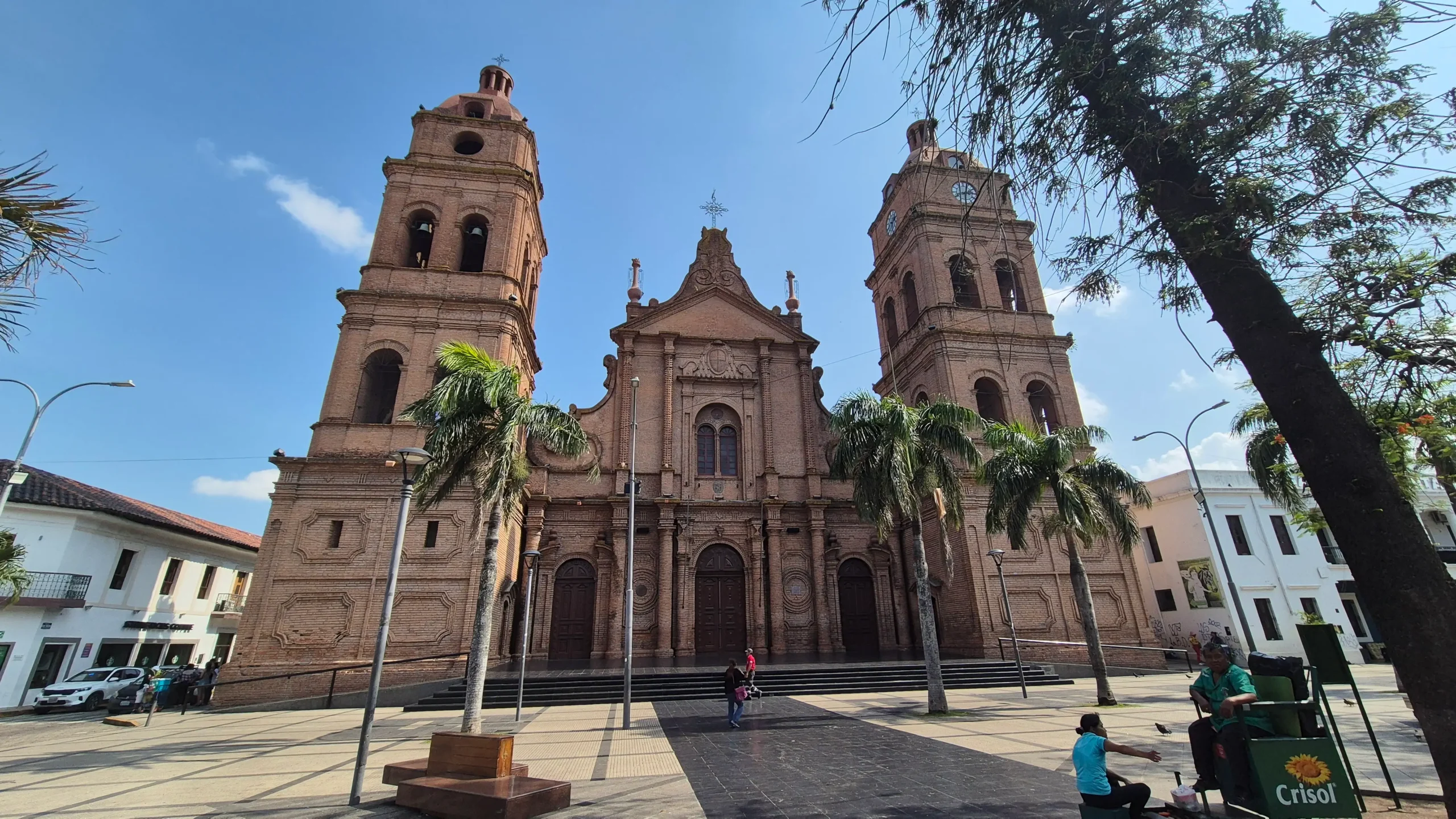 Santa Cruz de la Sierra a large brick church with two towers in a city square with palm trees, Santa Cruz de la Sierra, Bolivia