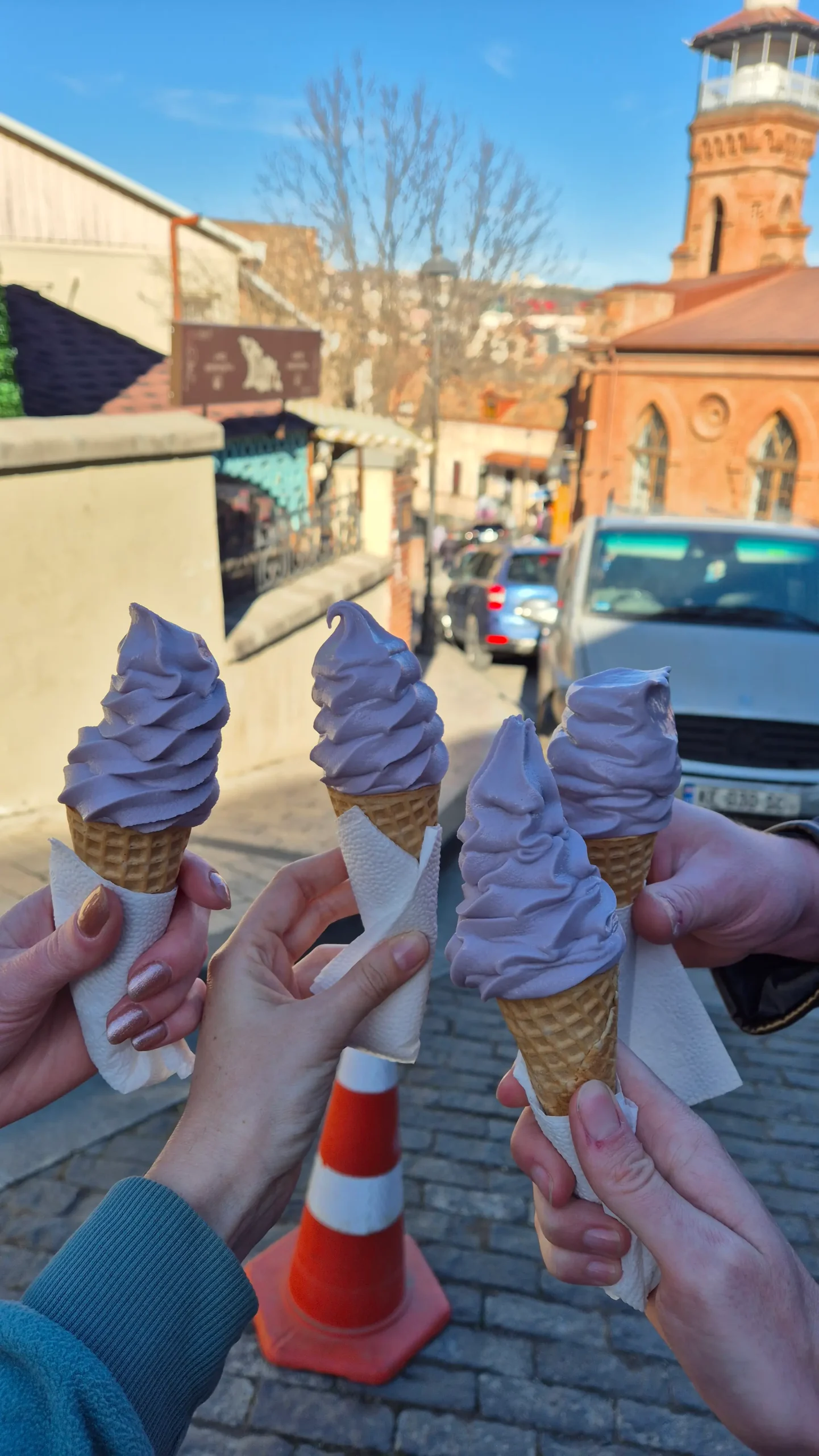 wine ice cream four cornets are filled with a pale purple ice cream flavoured with Georgian kindzmarauli red wine in Tbilisi