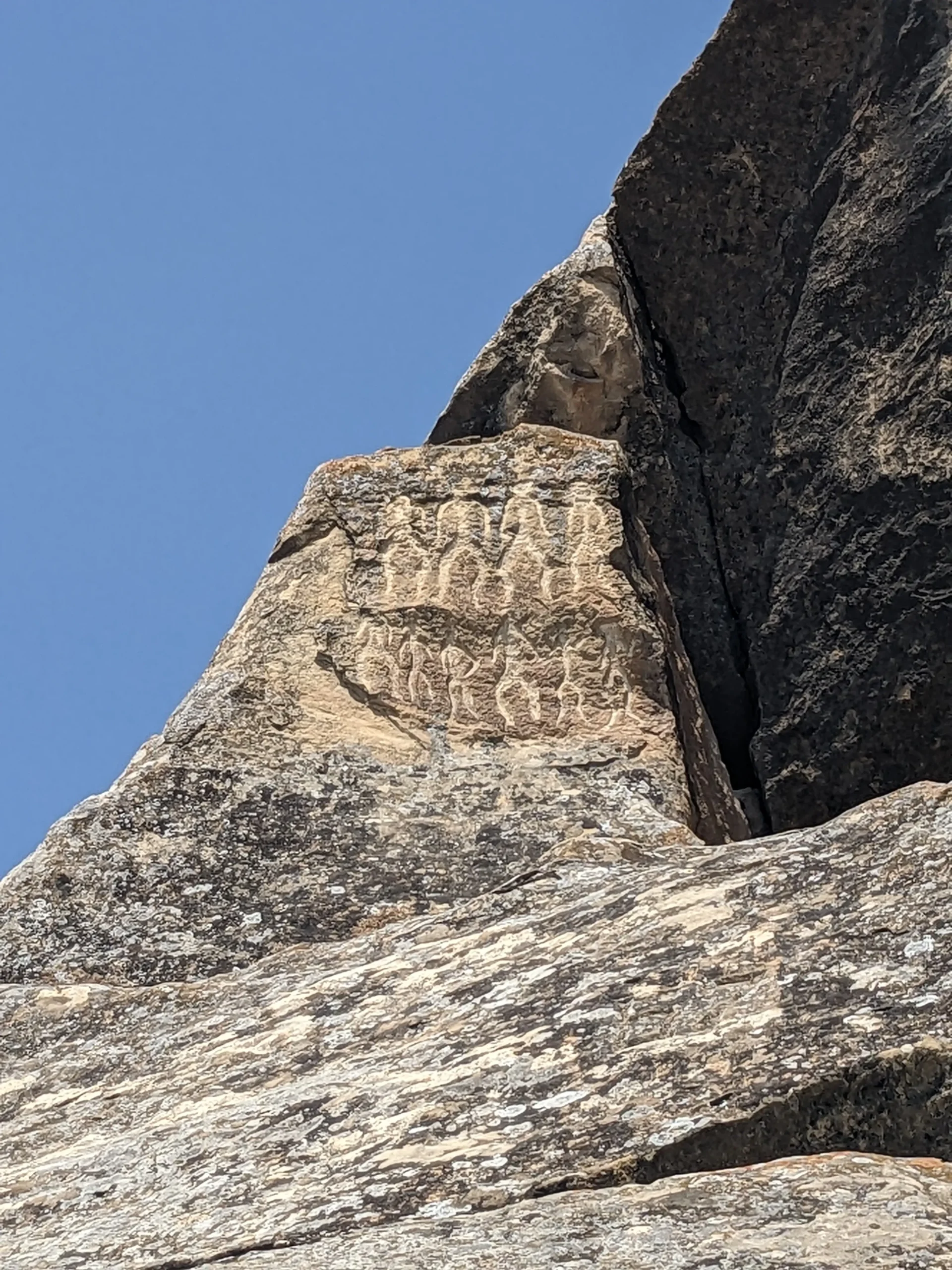 ancient rock carvings of people in Gobustan near Baku, Azerbaijan