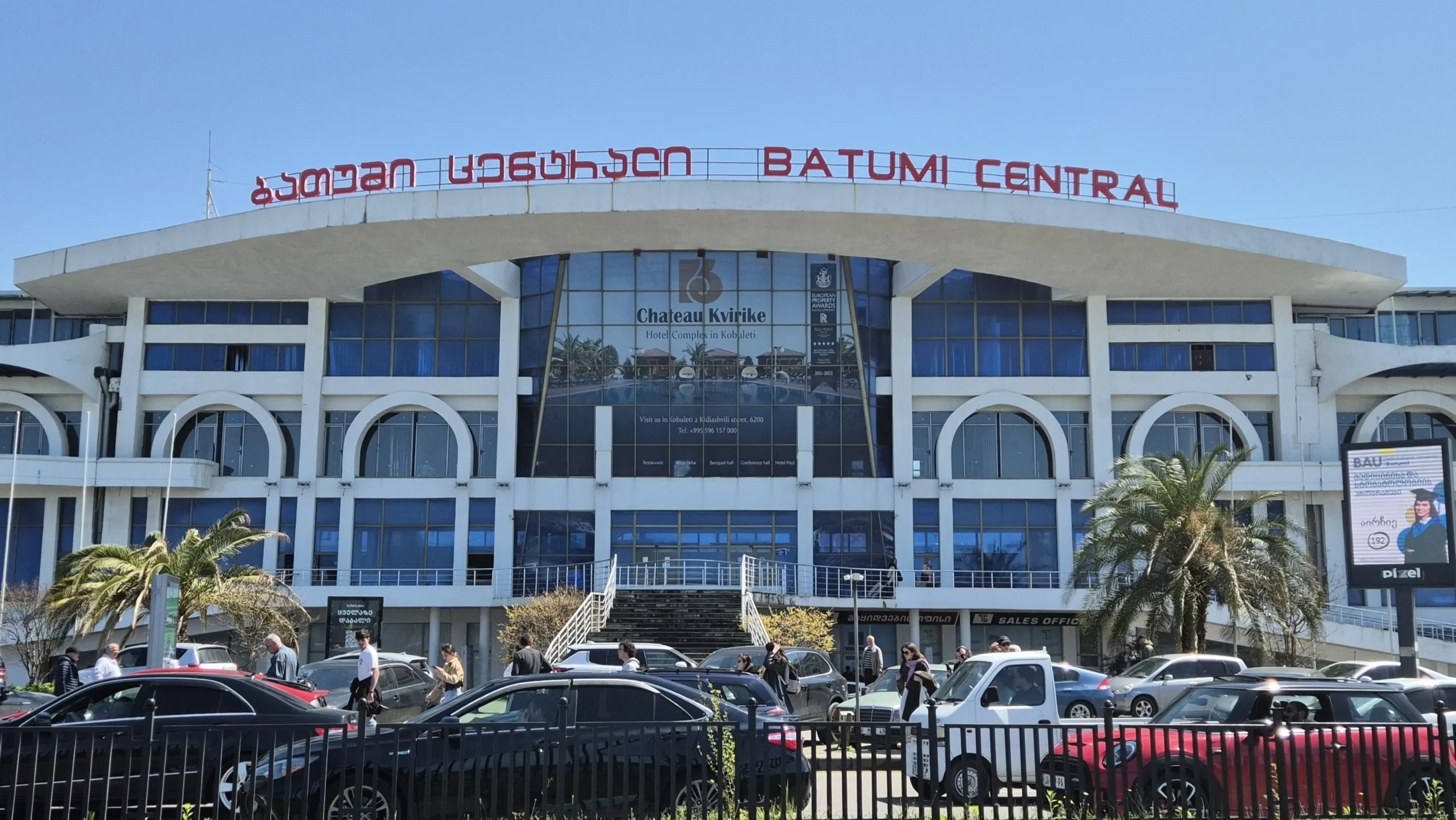 Batumi Central Train Station Batumi Central train station is a blue and white building with a red sign on the top written in Georgian and English