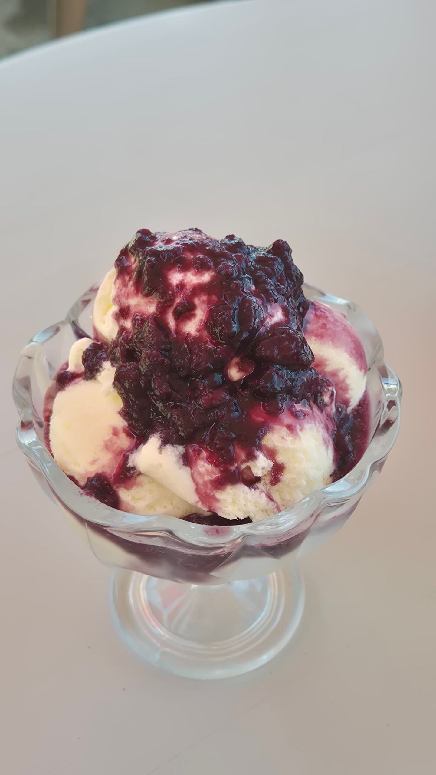Ice cream with wine a glass bowl of vanilla ice cream is covered with grape jam and red wine in Sighnaghi, Georgia