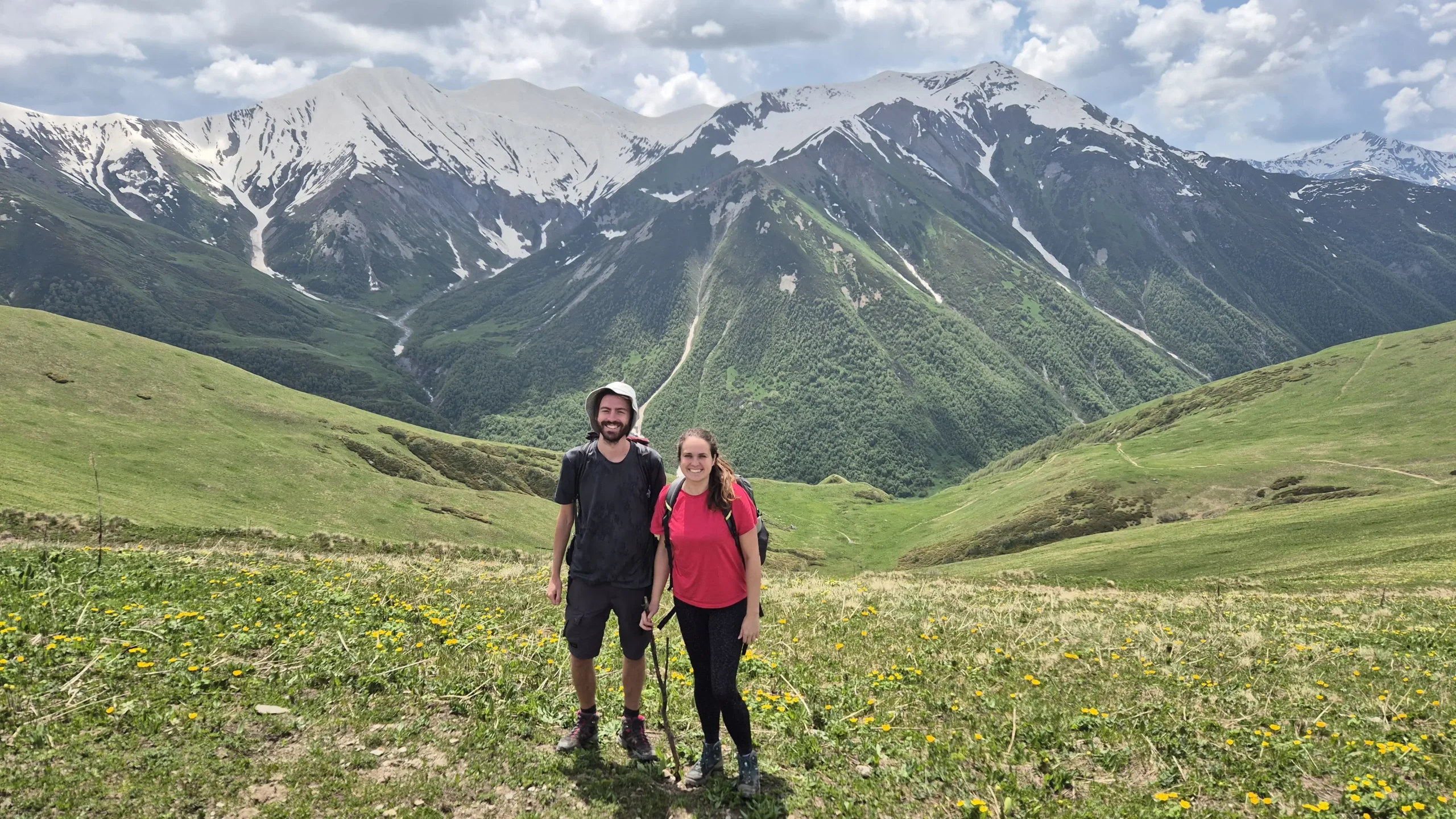 Highest point 2700m above sea level Chkhunderi Pass over 2700m above sea level - green mountains topped with snow
