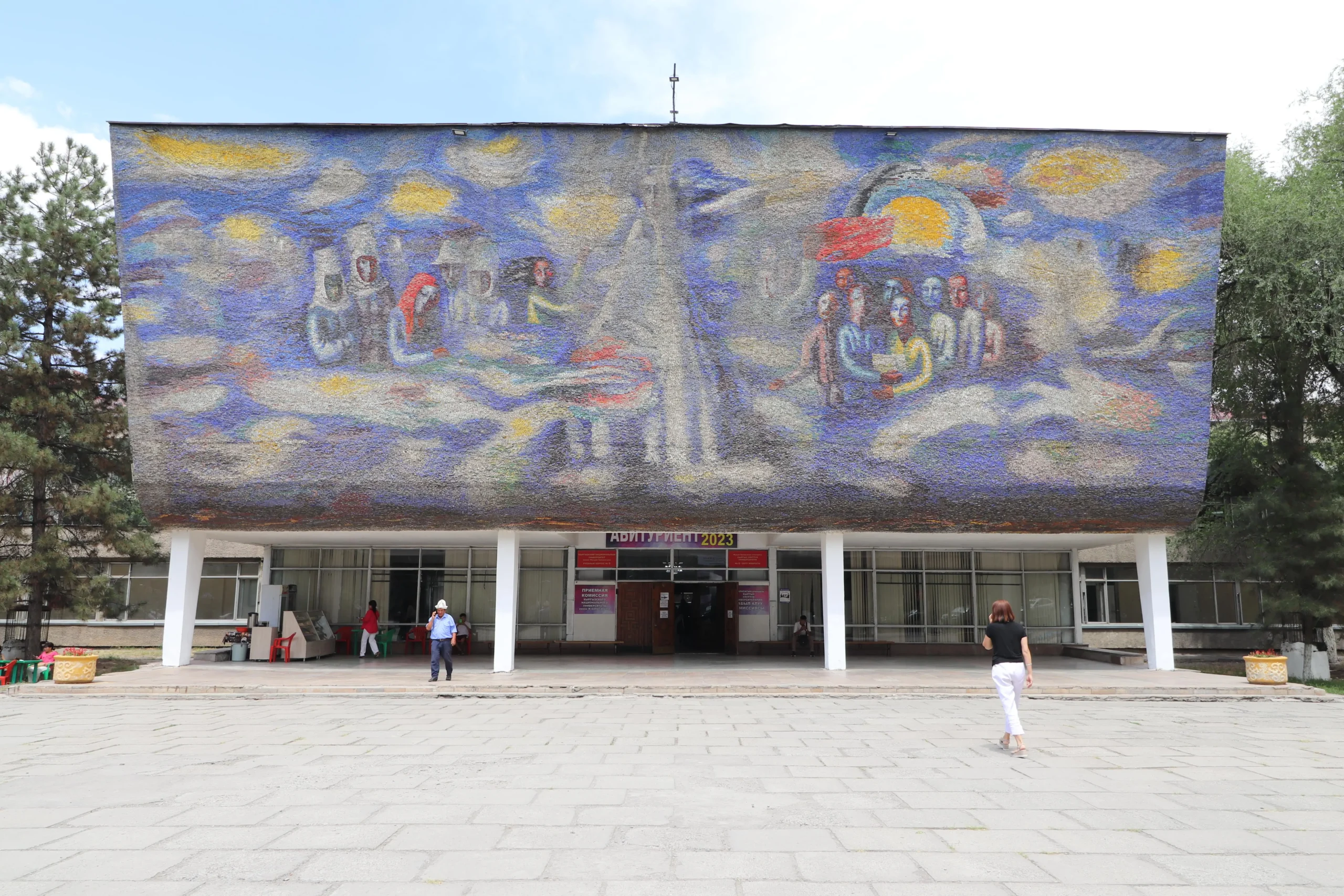 Enlightenment a huge Soviet-style mural mosaic depicts many different people on a blue background - Bishkek, Kyrgyzstan