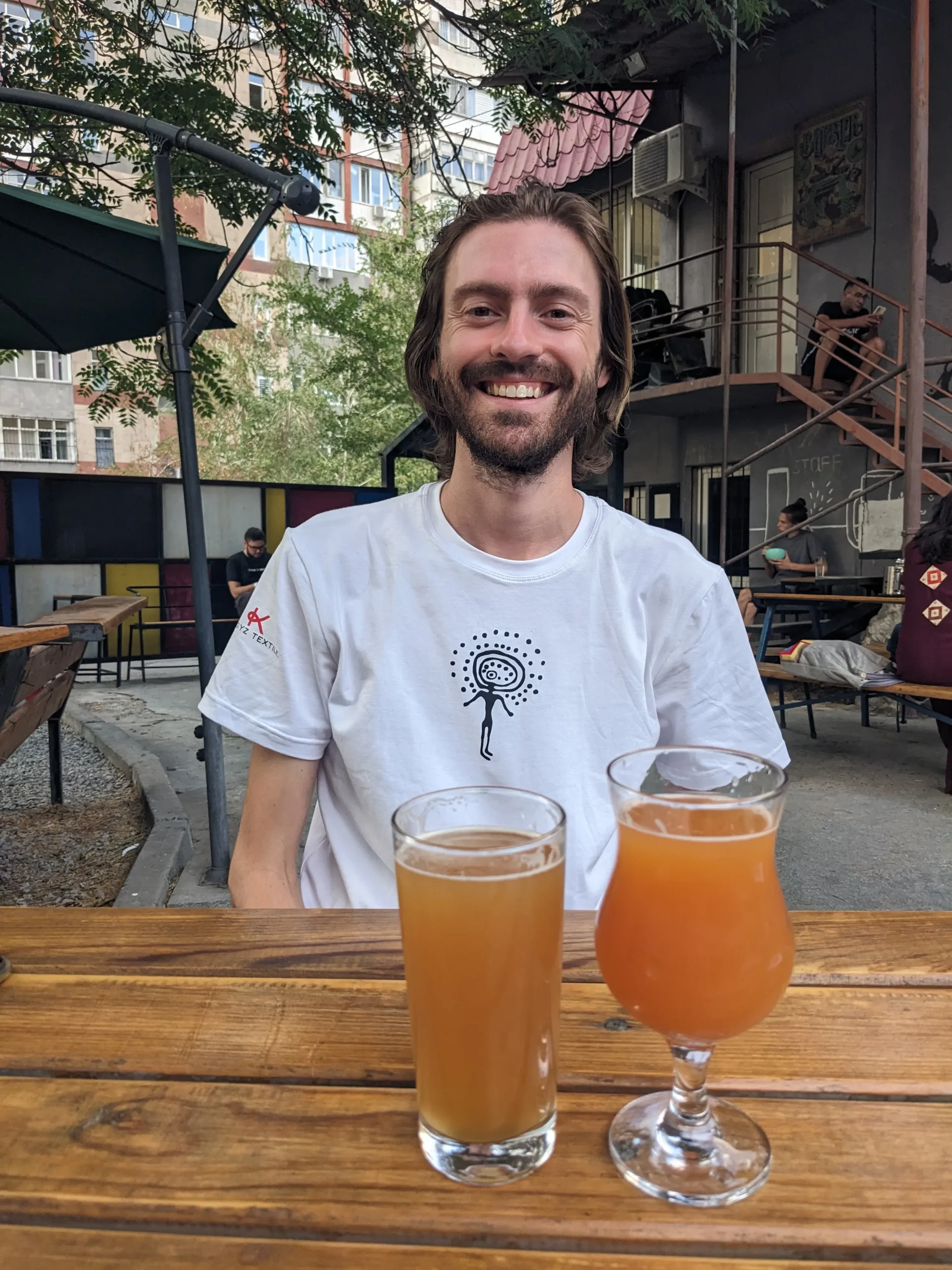 Chris with a cider and a beer PXL 20230801 135642204 scaled