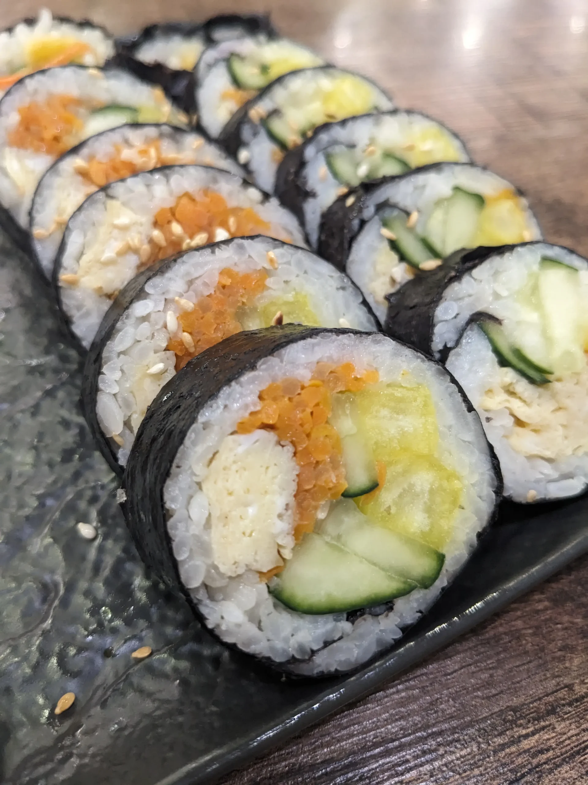 Kimbap vegetarian kimbap with cucumber, omelette, carrot and radish wrapped inside rice and seaweed at Cooksoo, Bishkek, Kyrgyzstan