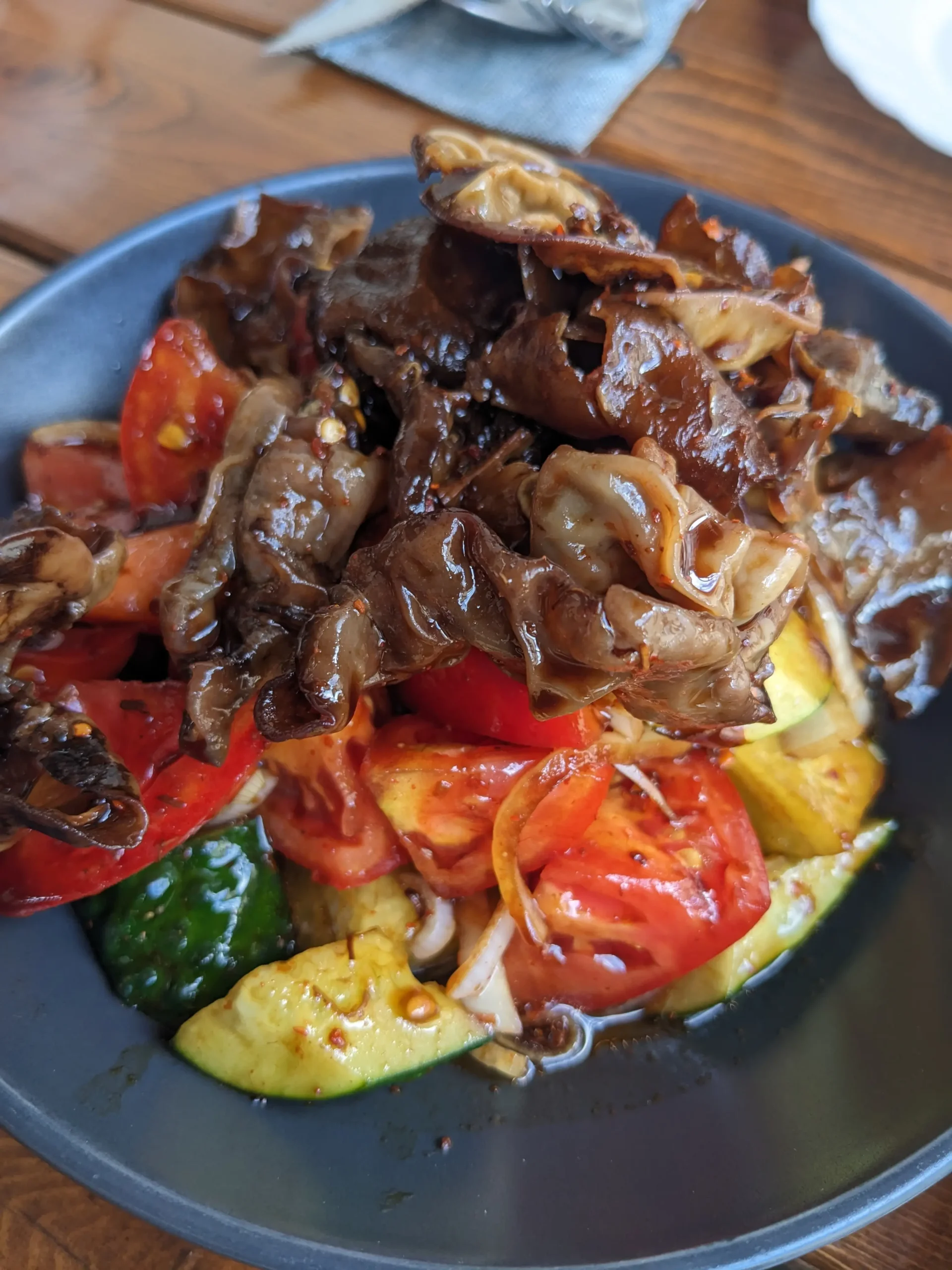 Wood Ear Mushroom Salad wood ear mushrooms, cucumber, tomato and onion mixed with a soy and chilli dressing - Karakol, Kyrgyzstan