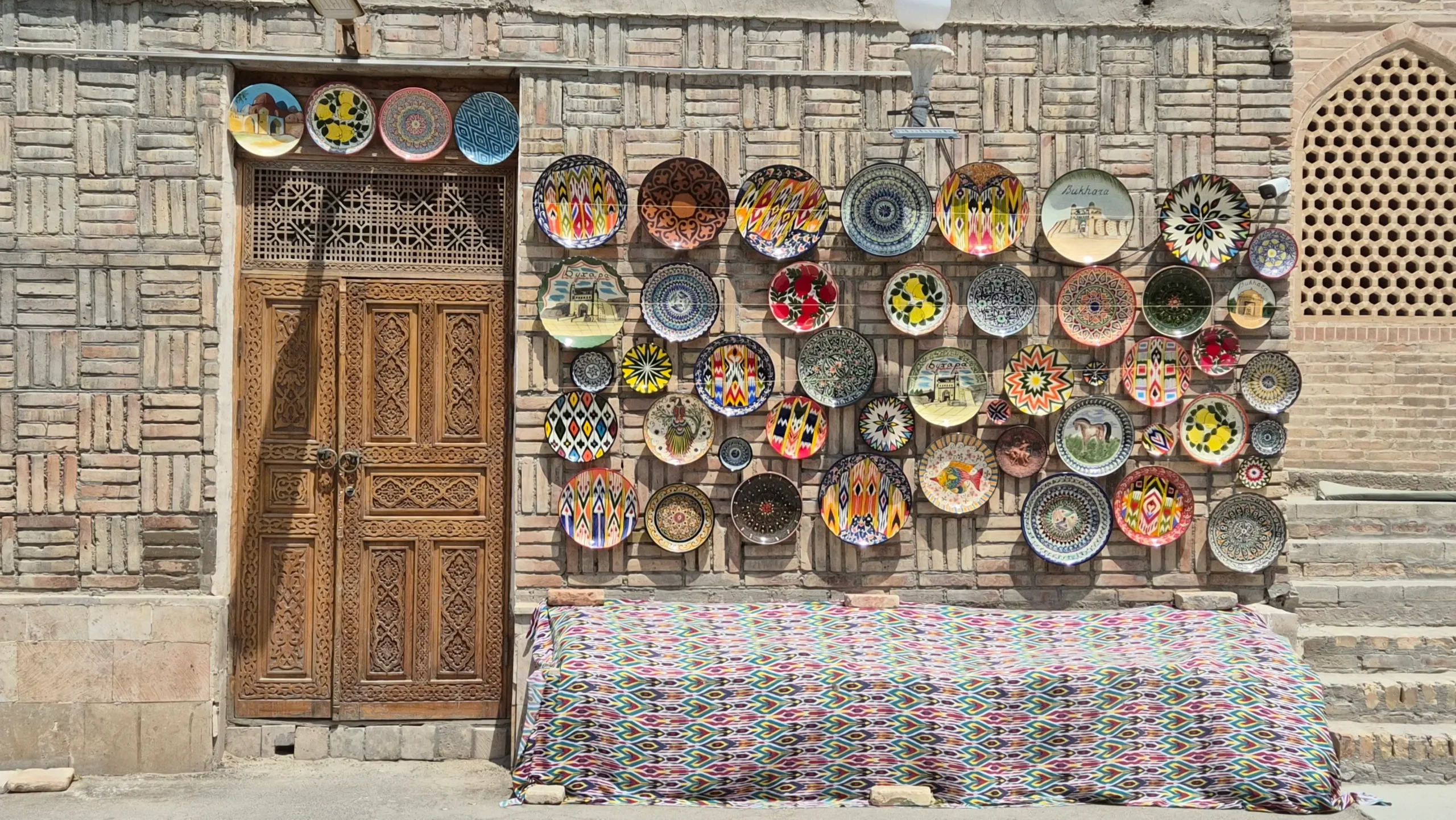 Cermaics shop in Bukhara a ceramics shop in Bukhara, has many colourful plates displayed on a wall