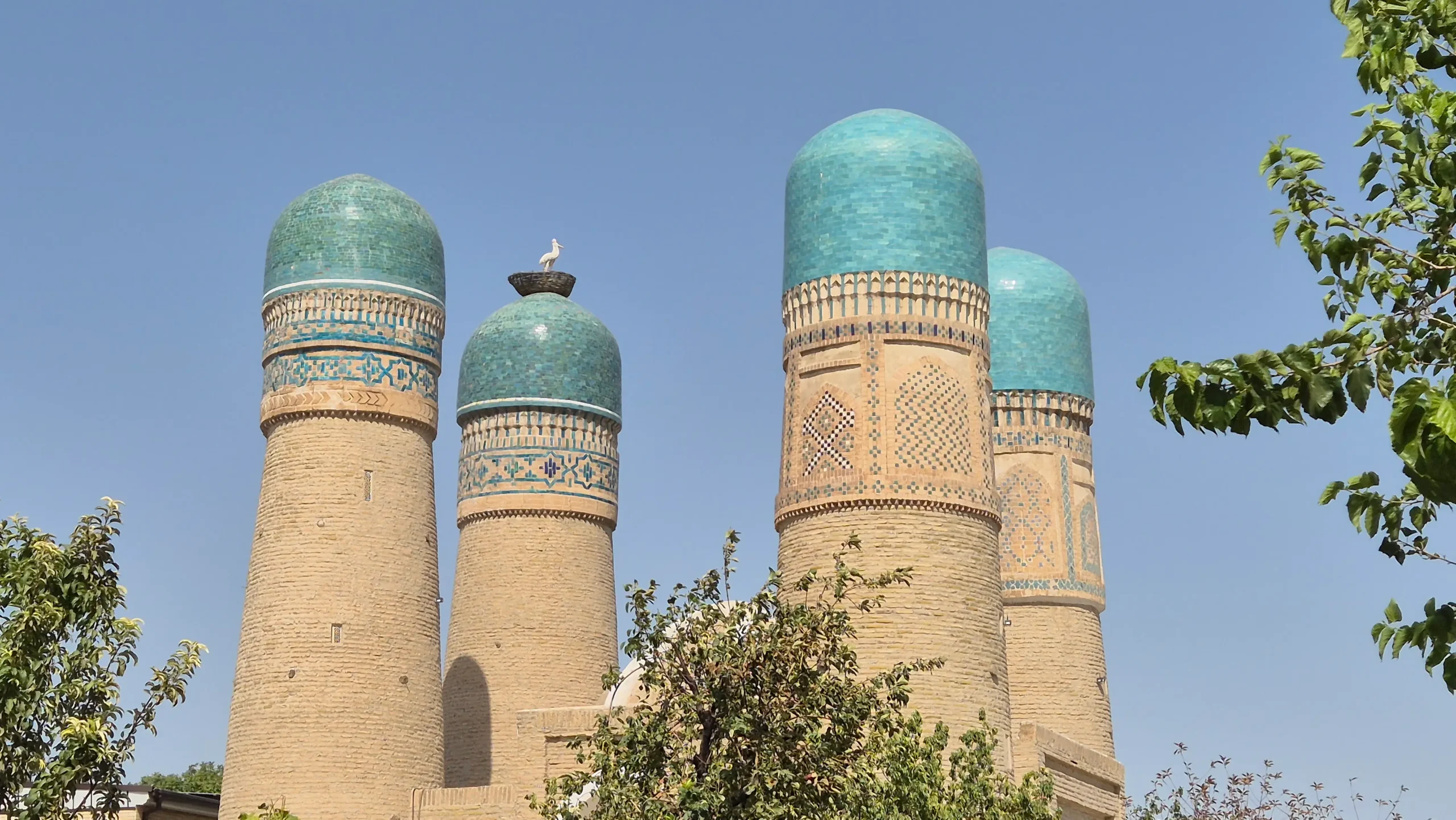Chor MInor Four brick minarets with light blue tiled minaret tops - Chor Minor Mosque - things to do in Bukhara