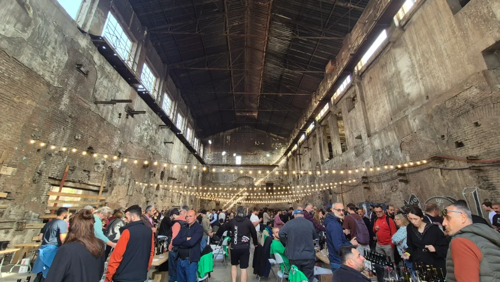 Natural Wine Festival a natural wine festival with many stands and visitors is held in an abandoned Soviet radio factory in Tbilisi, Georgia