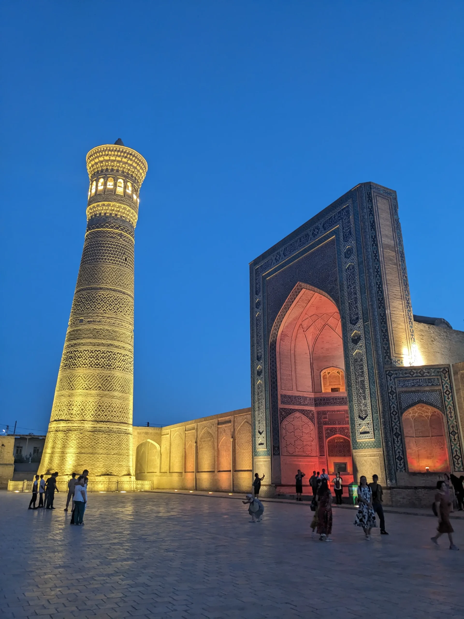 Po-i-Kalon lit up at night a historic mosque and brick minaret are lit up at night in Bukhara. Uzbkeistan
