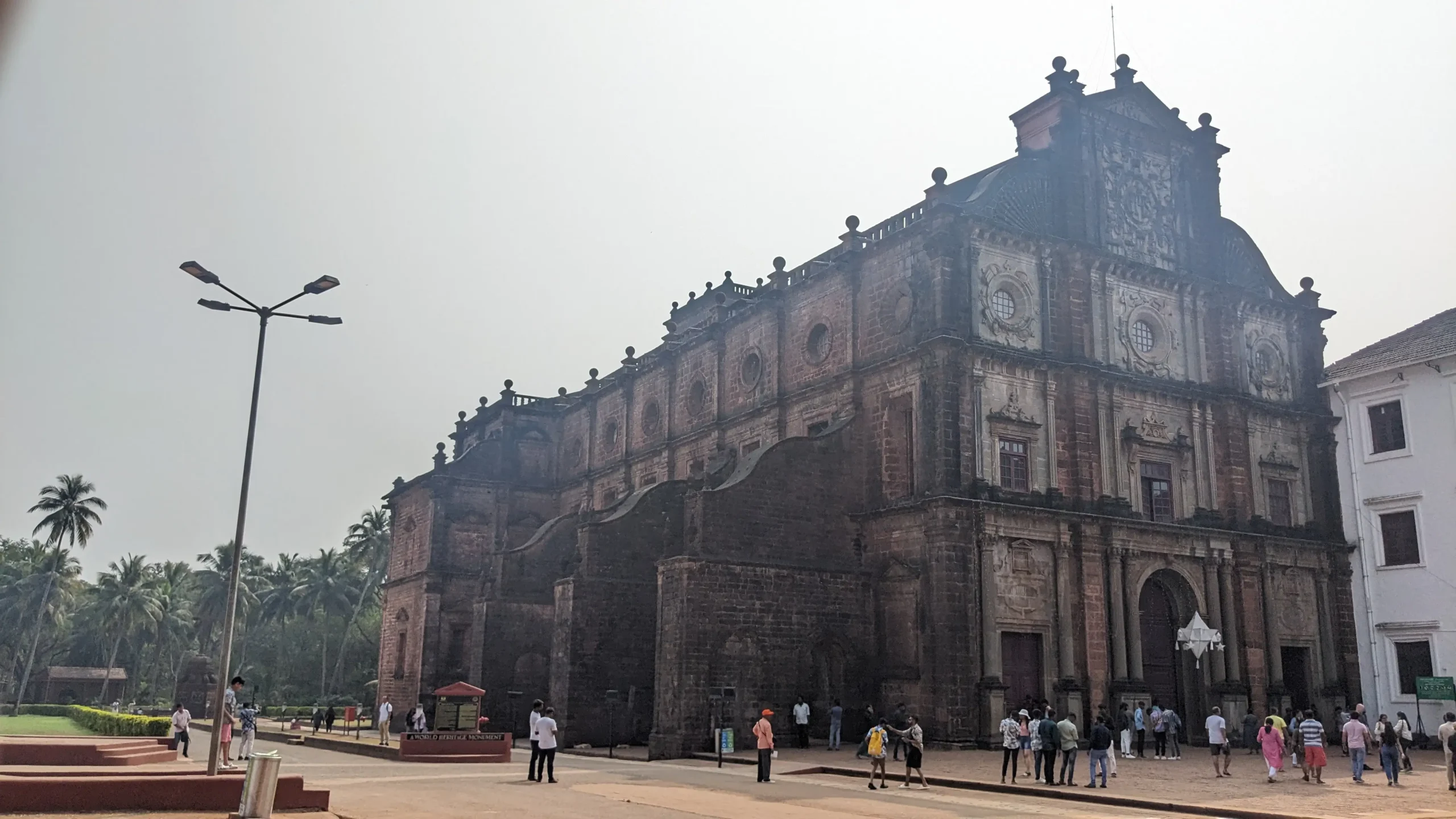 a large brown brick cathedral in Baroque style built by the Portuguese after colonising Goa. Basilica do Bom Jesus, Old Goa, India