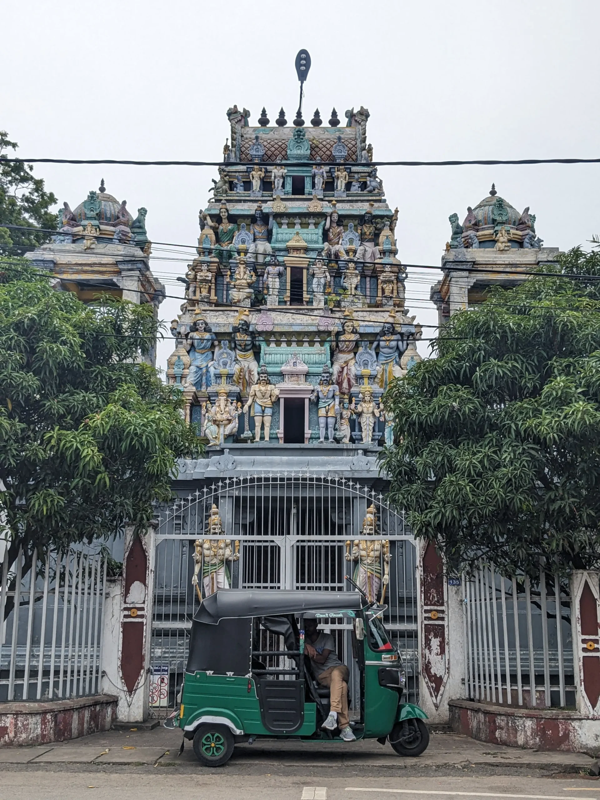 Hindu temple in Negombo a colourful Hindu temple has sculptures of gods in tiers on the roof