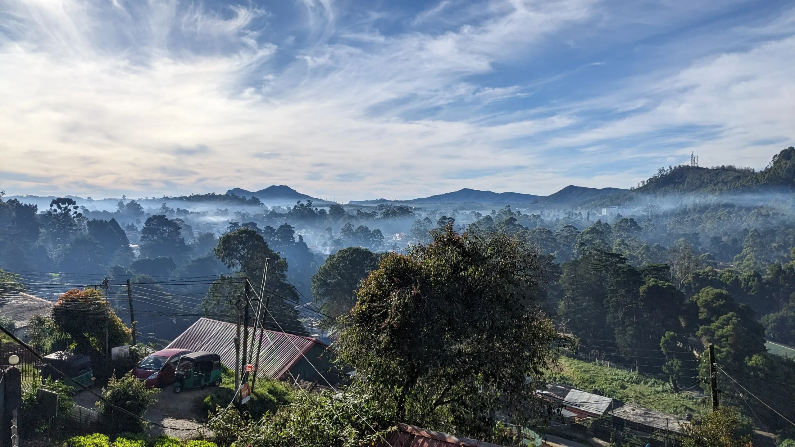 Views over Nuwara Eliya an early morning view over Nuwara Eliya has trees, rolling hills and plenty of green with a layer of haze that has yet to be burnt off by the sun. Nuwara Eliya, Sri Lanka