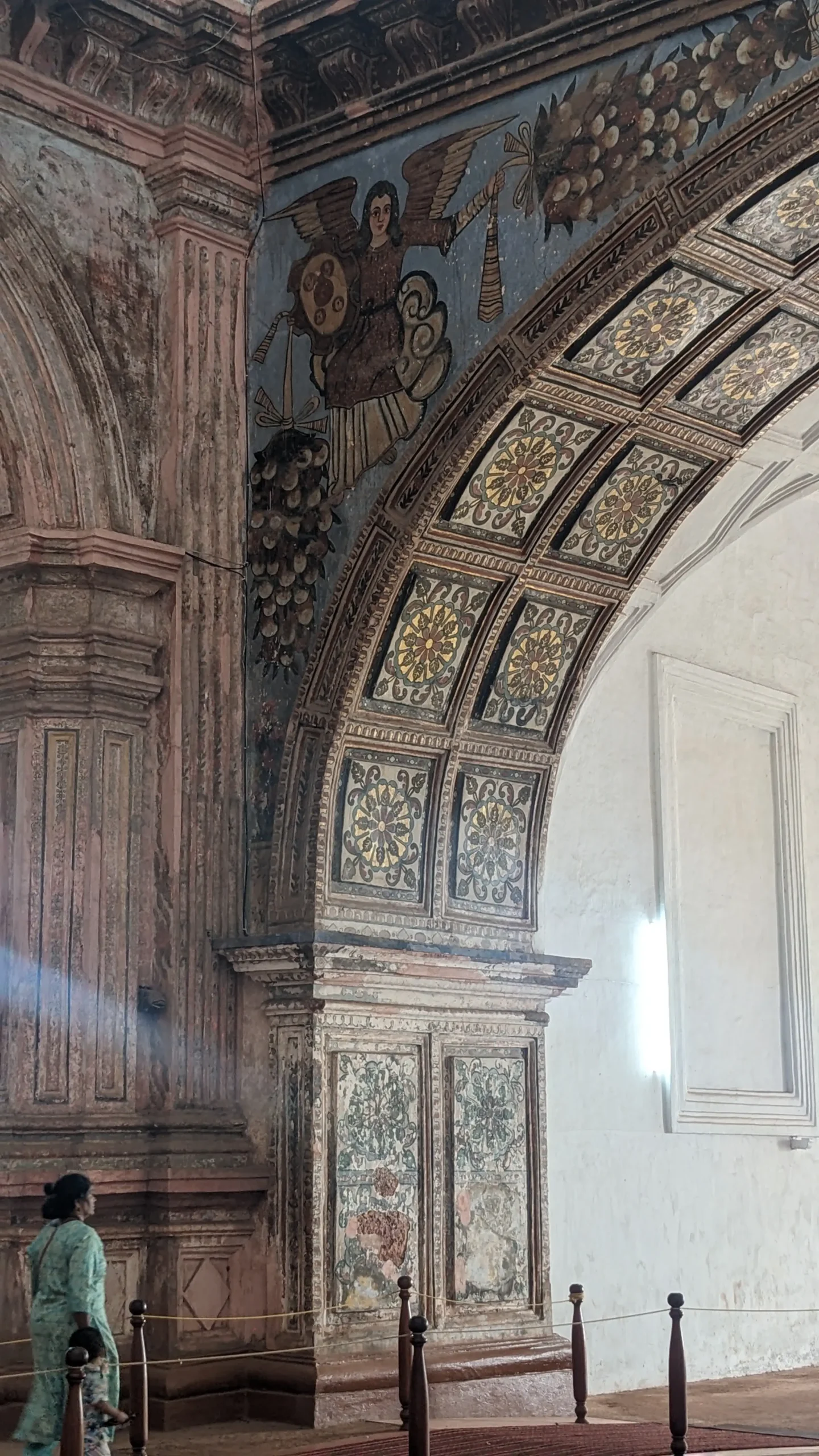 Old Goa artwork original religious artwork shows an angel with wings inside an old Portuguese Church in Old Goa, India