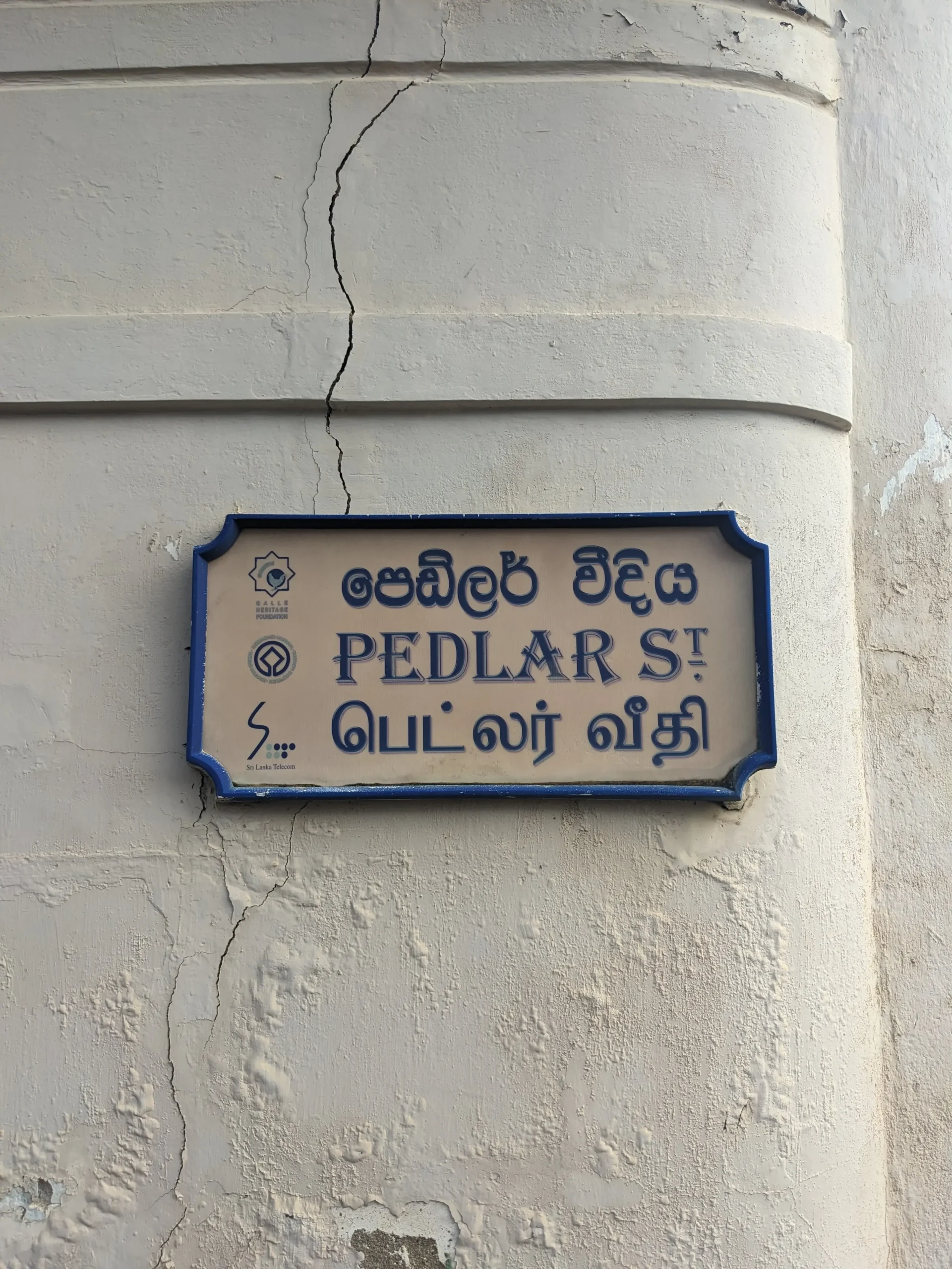 Sinhalese, Tamil, and English on a street sign sri lankan languages scaled