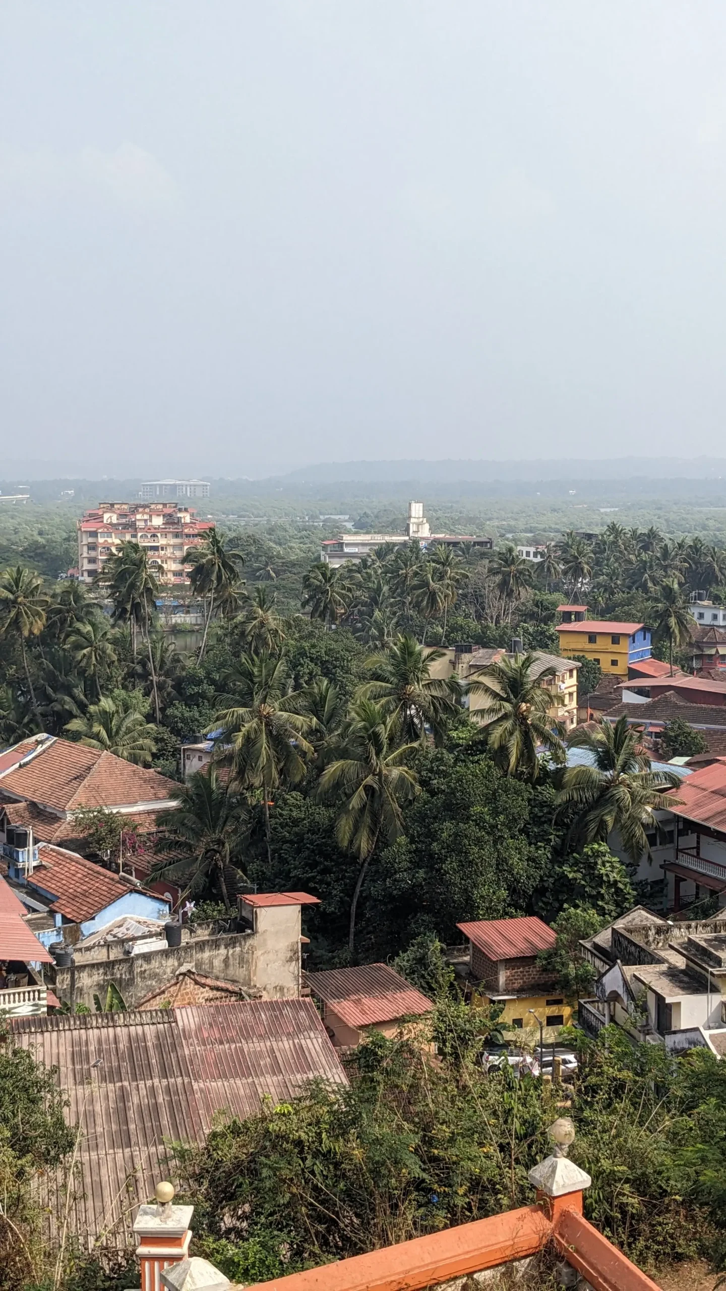 Views from Maruti Temple Views from Maruti Temple show colourful buildings surrounded by palm trees in Panaji, Goa, India
