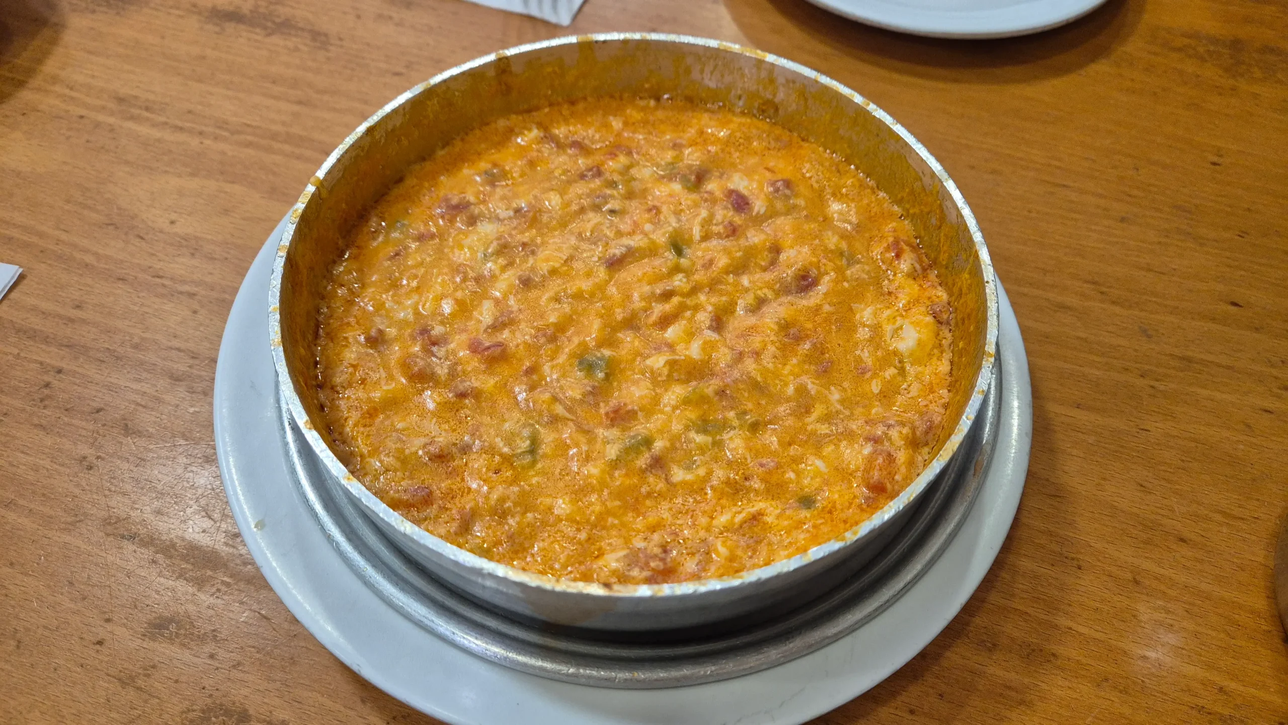 menemen a large bowl of thick and creamy menemen - Turkish tomato scrambled eggs.
