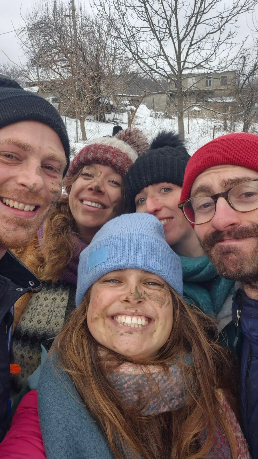 mud-covered faces after taking part in the festivities of Berikaoba, Didi Chailuri, Georgia