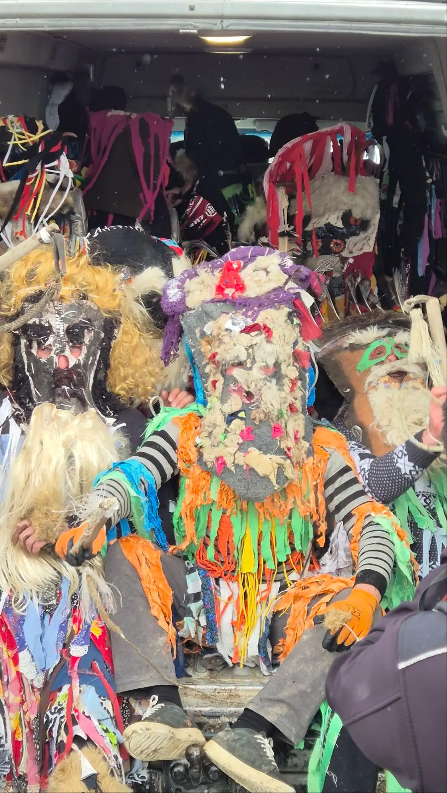 local men of Didi Chailuri, Georgia are dressed as Berikas for the Pagan festival of Berikaoba. They wear strips of material attached to colourful handmade costumes and painted masks