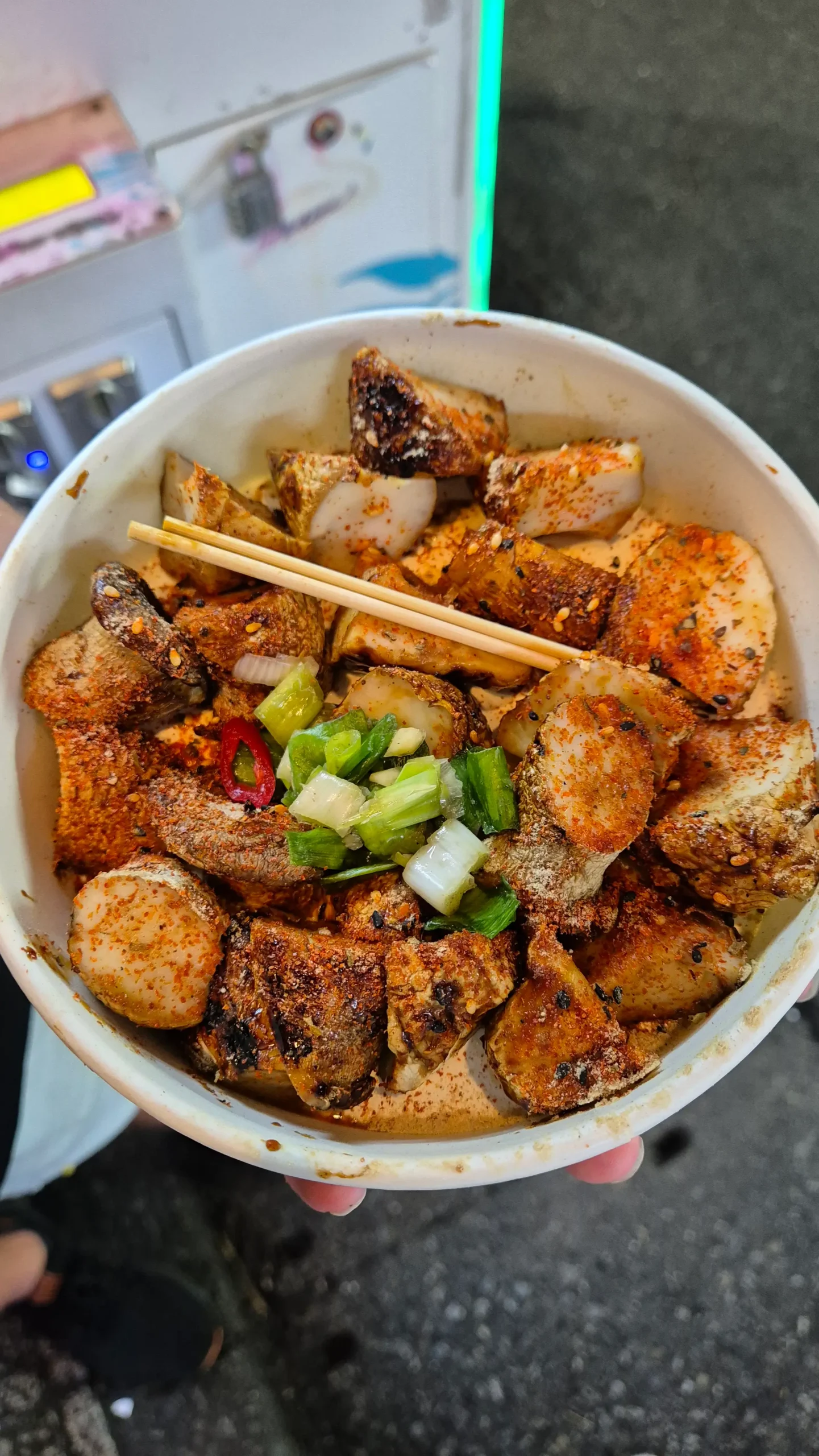 chunks of barbecued king oyster mushroom covered in a spicy orange powder, sesame seeds and spring onions - Taiwan vegetarian food