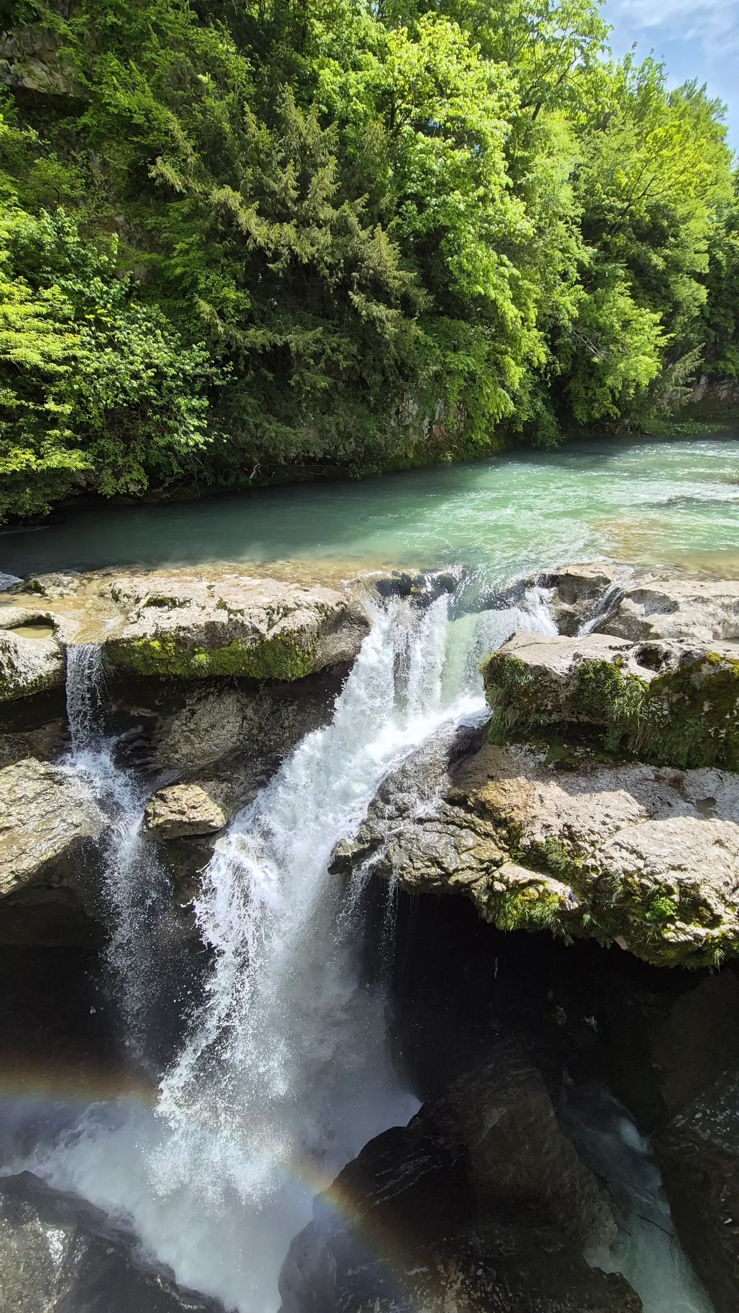 a river turns into a cascading waterfall at Martvili Canyon, Georgia