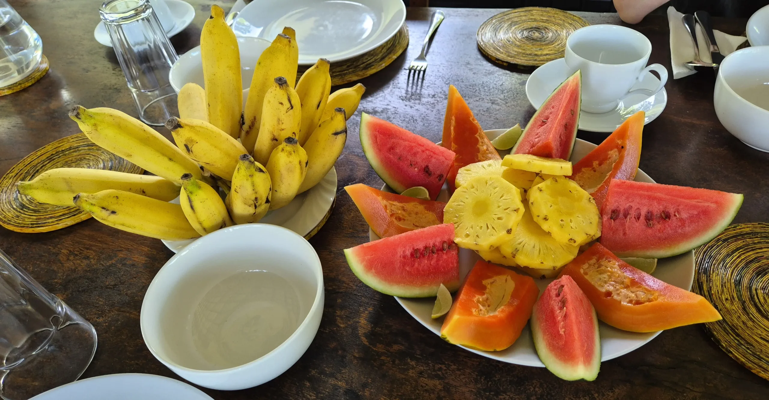 Amba Estate Breakfast a breakfast platter of tropical fruit - bananas, watermelon, papaya, pineapple