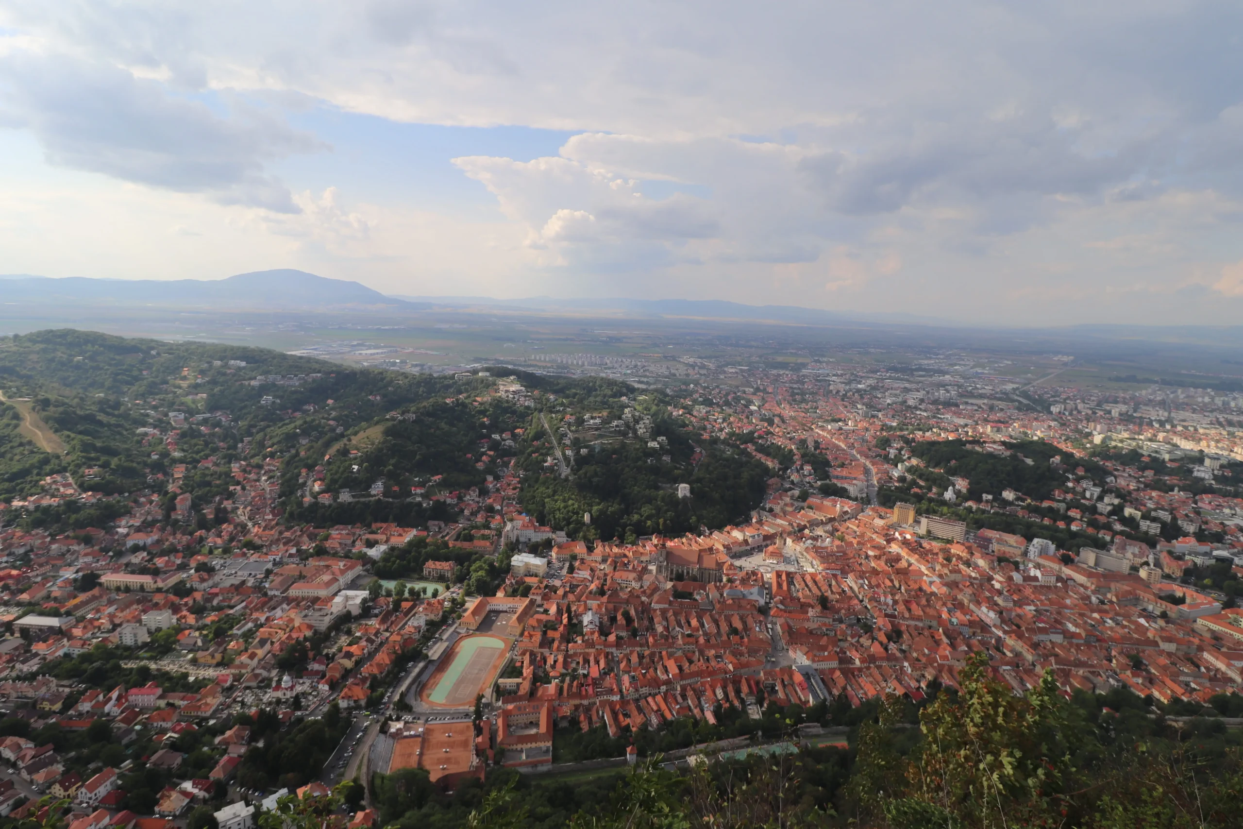 Tatev Monastery a city viewpoint looks over the orange rooftops of Brasov. things to do in Brasov